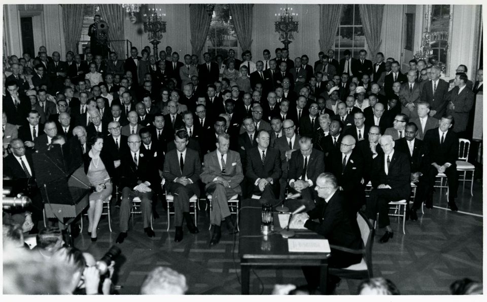 President Lyndon Johnson signing the 1964 Civil Rights Act