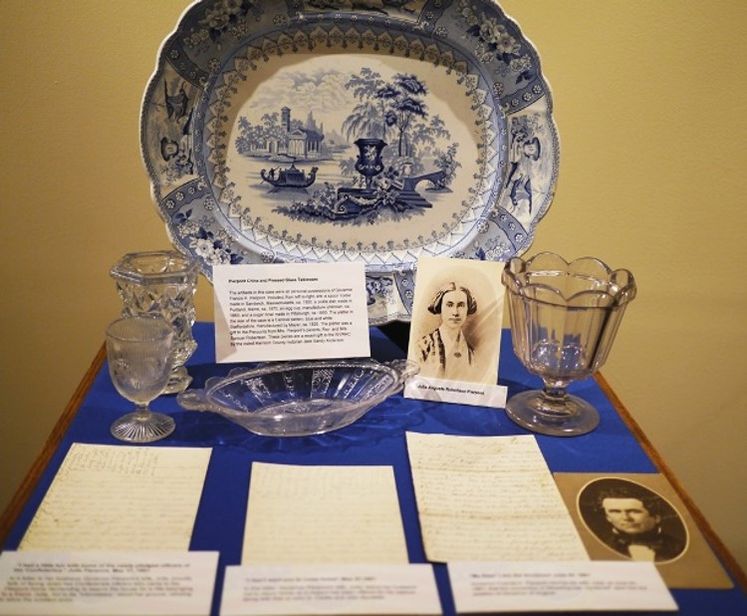 Selection of items concerning Governor and Mrs. Pierpont displayed on a blue cloth 