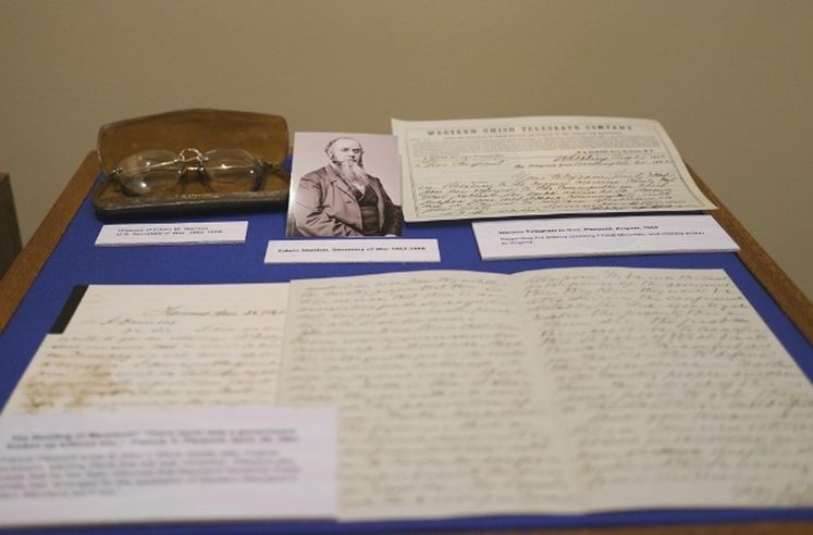 Selection of documents, a photo, and glasses in a brown case which belonged to Edwin M. Stanton.