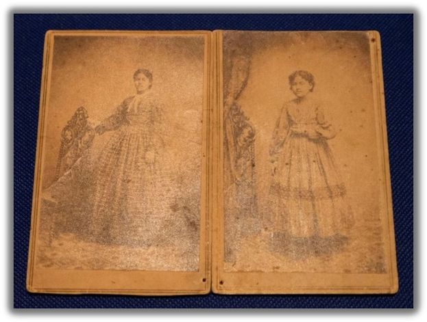 side by side portraits of two african american women, both wearing floor length dresses. on the left, she rests a hand on a wooden chair and as the other hangs at her side. On the right, she holds her hand angled at her waist. their hair is pulled back 