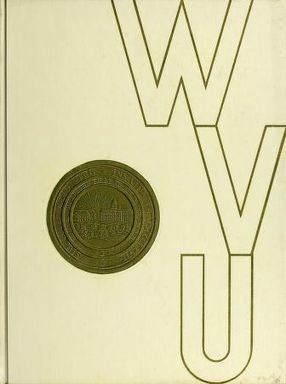 Cream colored yearbook cover with WVU written in gold vertically on the right and the univeristy seal on the left