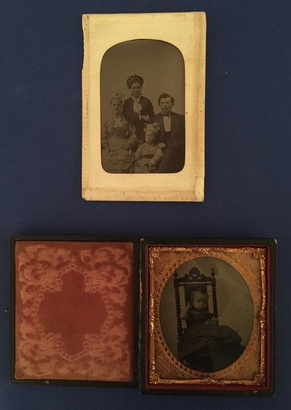 Two tinype images on a dark blue background. The top has a yellow-brown frame and is a photo of a family, the bottom is a photo of a young child. To the left of the photo is a photocase. 
