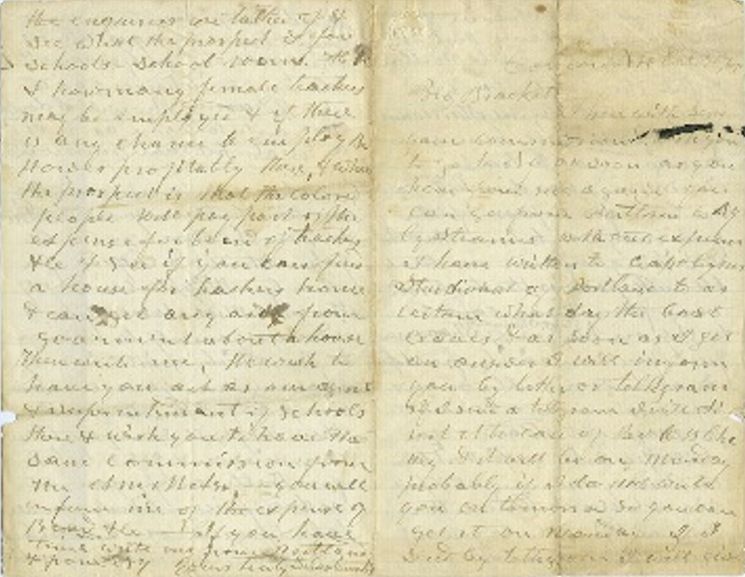 A letter, two pages spread, in cursive on yellowed paper