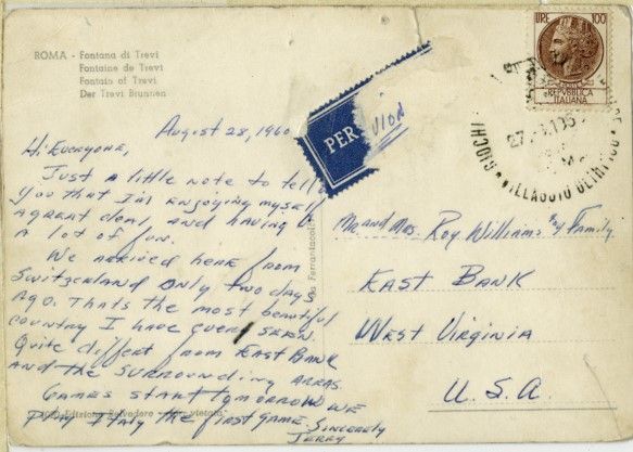 The reverse side of the postcard, including postage and a message from Jerry saying he is enjoying his time at the olympics, having fun. He says they arrived in rome from Switzerland, and that it was the most beautiful country he has ever seen
