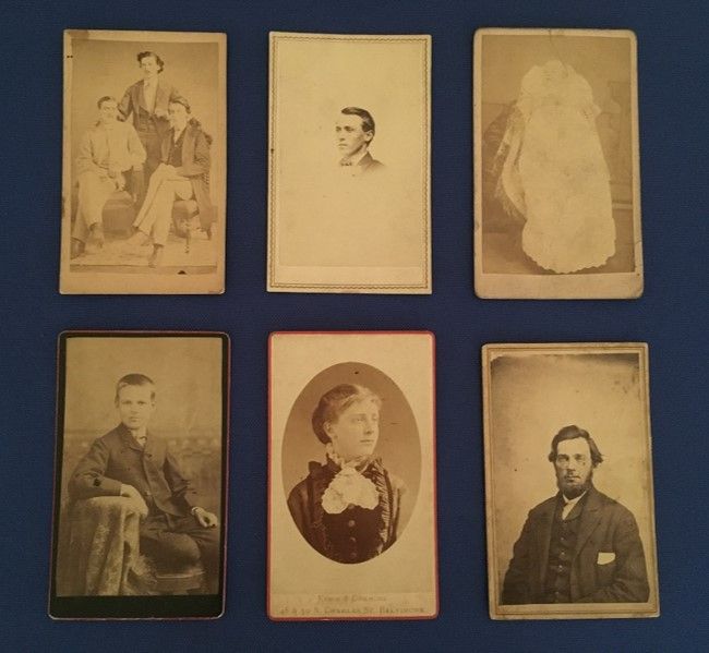 A selection of 6 CDV images: three people posing together, a young man, a baby in a long white gown, a young boy in a chair, a young woman, and a man with glasses and a dark beard