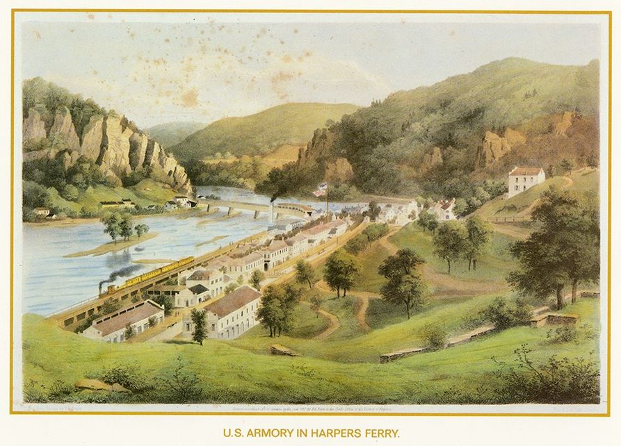 A lithograph of the armory in Harpers Ferry. It is a large white building next to a river, surrounded by rolling hills, trees and a blue sky