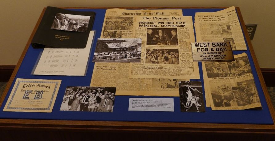 Several documents detailing the success of the East Bank High Pioneers basketball team from 1955-56