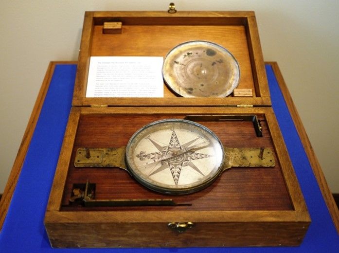 Compass in a wooden box used by Franics Deakins. 