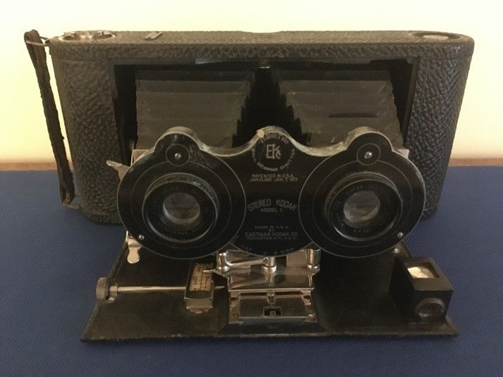 A stereoscope—a large box with a set of lenses to look through