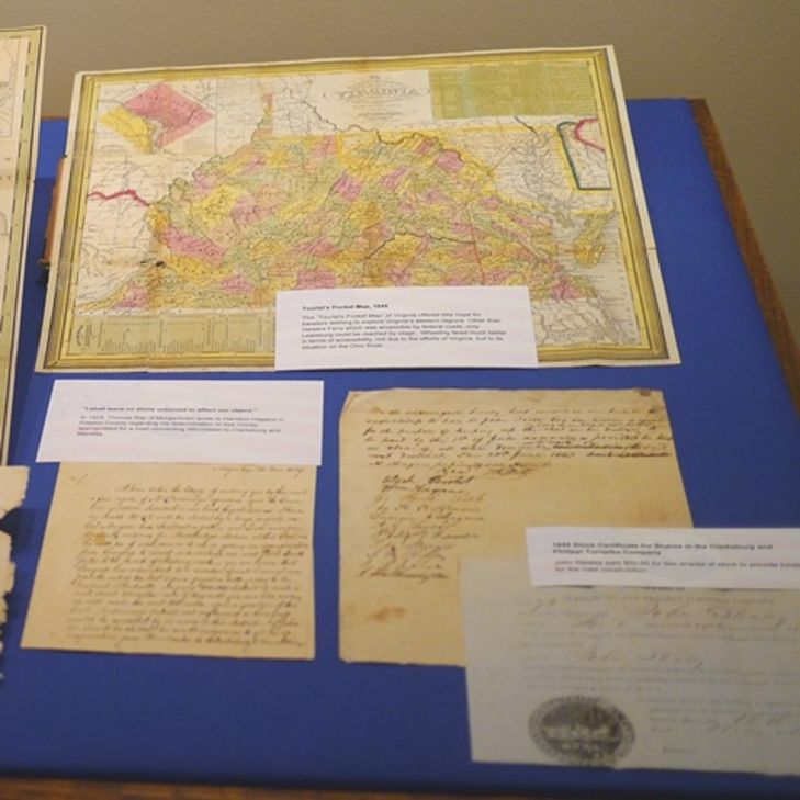 Selection of tourist maps and certificates for shares in the 1854 Clarksburg and Philippi Turnpike Company.