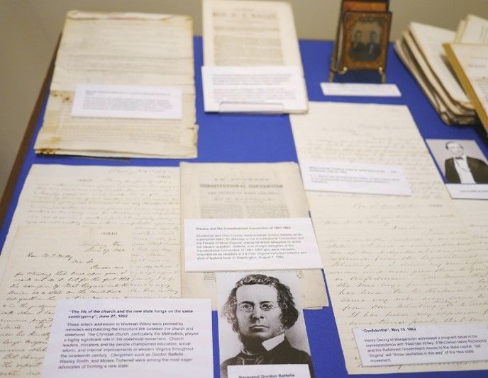 Selection of documents concerning WV statehood displayed on a blue background. 