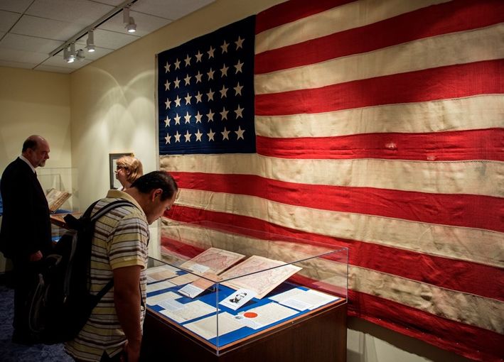 A 35-star United States flag hanging displayed on a wall