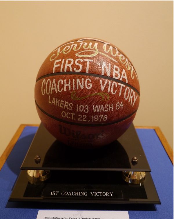 A game ball commemorating Jerry west's first NBA coaching victory. "Lakers 103, Wash 84, October 22, 1976"