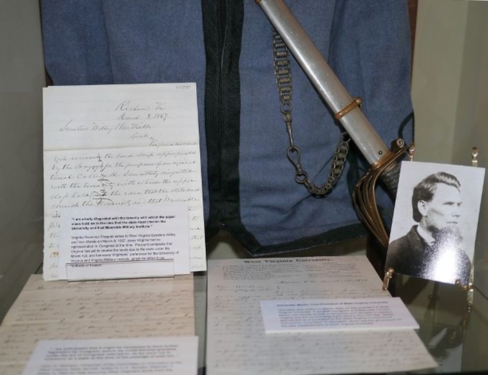 documents and a cadet uniform pertaining to how West Virginia statehood interacted with WVU